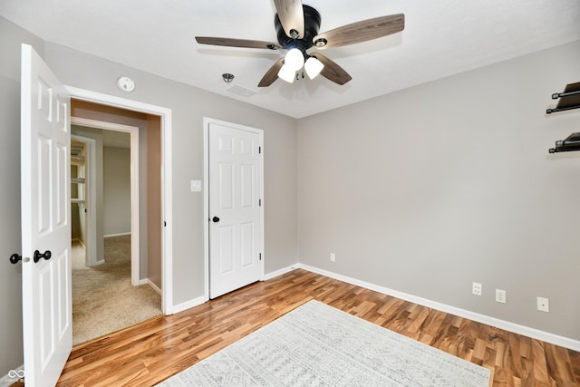 3675 Homestead Cir E, Plainfield, IN 46168 - unfurnished bedroom featuring wood finished floors and ceiling fan