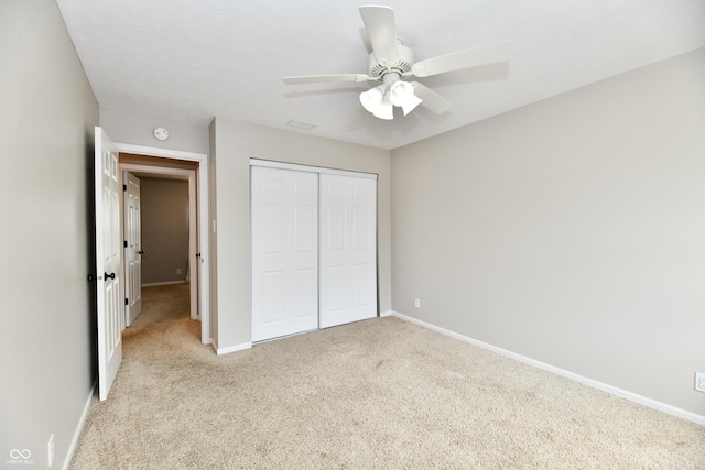 3675 Homestead Cir E, Plainfield, IN 46168 - unfurnished bedroom with carpet flooring, a closet, and a ceiling fan