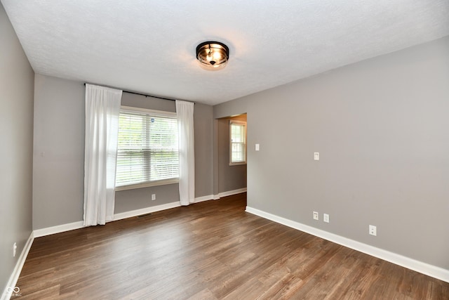 3675 Homestead Cir E, Plainfield, IN 46168 - empty room featuring baseboards and wood finished floors