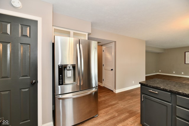 3675 Homestead Cir E, Plainfield, IN 46168 - kitchen featuring stainless steel fridge with ice dispenser and light wood-style floors