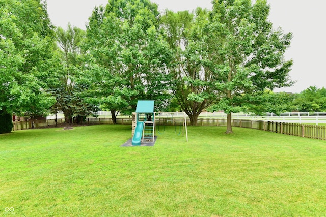 3675 Homestead Cir E, Plainfield, IN 46168 - fenced backyard featuring a playground