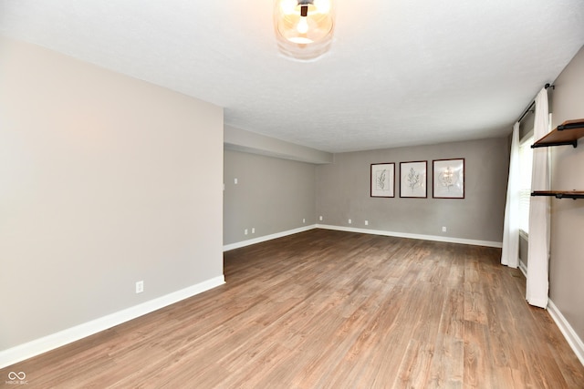 3675 Homestead Cir E, Plainfield, IN 46168 - unfurnished living room featuring light wood-style flooring and baseboards