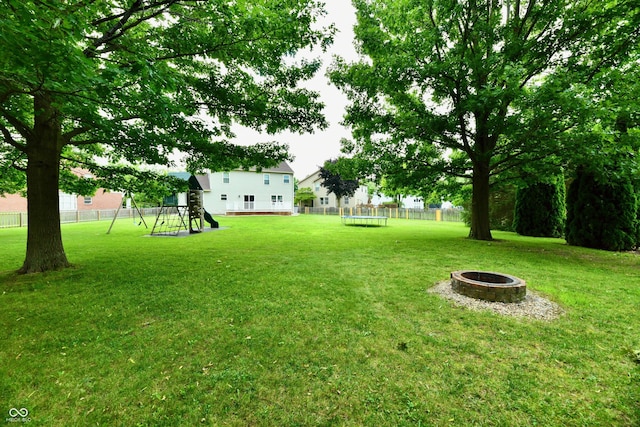 3675 Homestead Cir E, Plainfield, IN 46168 - view of yard featuring a fire pit and a playground