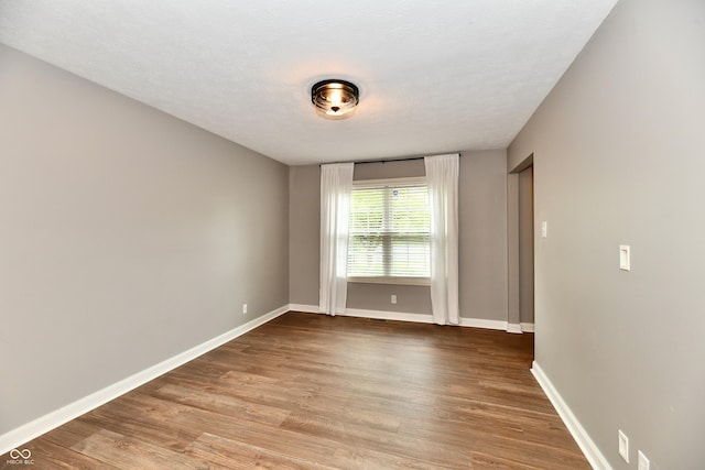 3675 Homestead Cir E, Plainfield, IN 46168 - spare room with wood finished floors and baseboards
