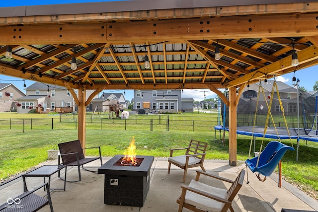 1425 Turkington Ct, Greenwood, IN 46143 - view of patio / terrace with a trampoline, a fire pit, a gazebo, and a residential view