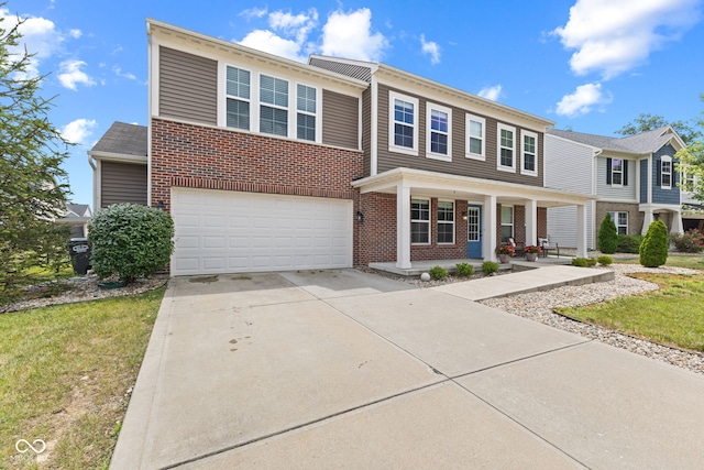 1425 Turkington Ct, Greenwood, IN 46143 - view of front of house featuring a porch, a garage, brick siding, and driveway