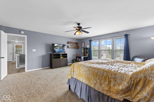 1425 Turkington Ct, Greenwood, IN 46143 - carpeted bedroom with baseboards and a ceiling fan