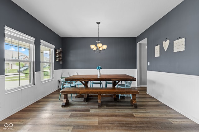 1425 Turkington Ct, Greenwood, IN 46143 - dining space featuring a chandelier, wood finished floors, and wainscoting