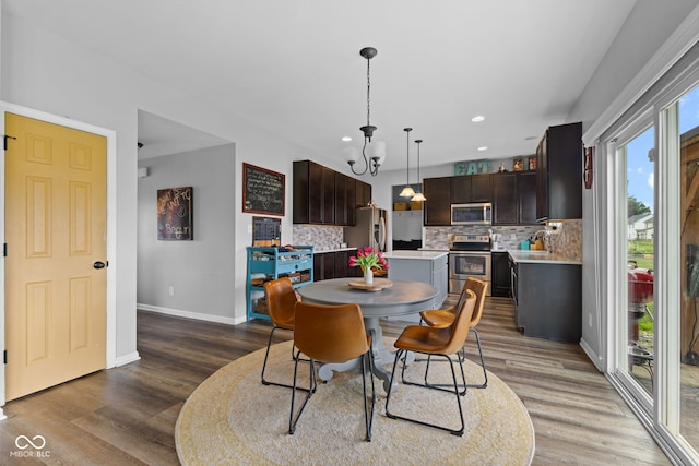 1425 Turkington Ct, Greenwood, IN 46143 - dining room with wood finished floors, a chandelier, and recessed lighting