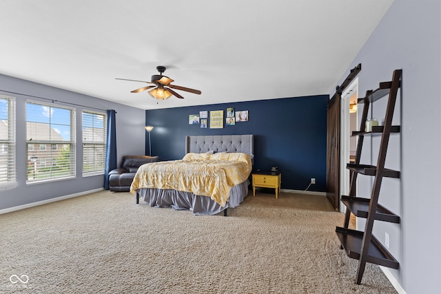 1425 Turkington Ct, Greenwood, IN 46143 - carpeted bedroom featuring a barn door and a ceiling fan