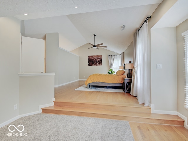 11668 Victoria Ct, Carmel, IN 46033 - bedroom with wood finished floors, vaulted ceiling, a ceiling fan, and recessed lighting