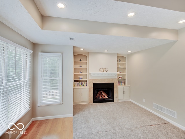 11668 Victoria Ct, Carmel, IN 46033 - unfurnished living room with a fireplace, healthy amount of natural light, recessed lighting, and wood finished floors