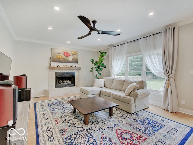 11668 Victoria Ct, Carmel, IN 46033 - living area featuring ceiling fan, recessed lighting, wood finished floors, ornamental molding, and a fireplace with raised hearth