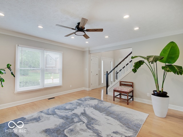 11668 Victoria Ct, Carmel, IN 46033 - entryway featuring crown molding, stairs, wood finished floors, ceiling fan, and recessed lighting