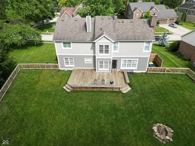 11668 Victoria Ct, Carmel, IN 46033 - back of house featuring a chimney, a wooden deck, a fenced backyard, roof with shingles, and a residential view