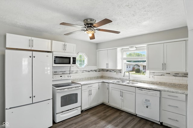 363 N 19th Ave, Beech Grove, IN 46107 - kitchen featuring white appliances, a textured ceiling, white cabinetry, light countertops, and backsplash