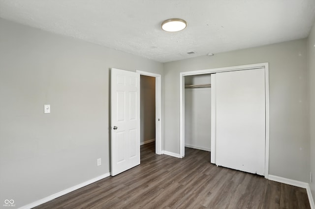 363 N 19th Ave, Beech Grove, IN 46107 - unfurnished bedroom with wood finished floors and a closet