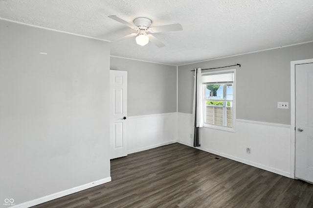 363 N 19th Ave, Beech Grove, IN 46107 - spare room featuring dark wood finished floors, a textured ceiling, and a ceiling fan