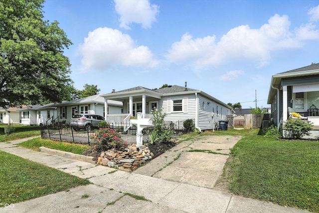 363 N 19th Ave, Beech Grove, IN 46107 - view of front of house with covered porch, driveway, and a fenced front yard