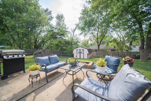 5514 Meckes Ln, Indianapolis, IN 46237 - fenced backyard with outdoor lounge area, a patio area, a storage unit, and grilling area