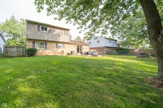 5514 Meckes Ln, Indianapolis, IN 46237 - rear view of house featuring brick siding and a fenced backyard