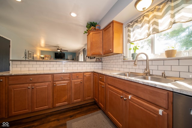 5514 Meckes Ln, Indianapolis, IN 46237 - kitchen featuring backsplash, brown cabinets, dishwasher, ceiling fan, and dark wood-style flooring