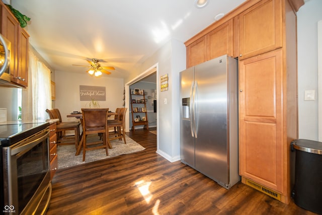 5514 Meckes Ln, Indianapolis, IN 46237 - kitchen with stainless steel appliances, dark wood-type flooring, ceiling fan, and brown cabinetry