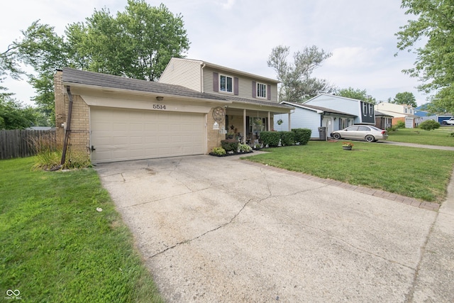 5514 Meckes Ln, Indianapolis, IN 46237 - traditional-style house with brick siding, a garage, concrete driveway, and covered porch