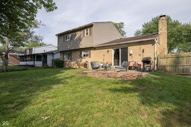 5514 Meckes Ln, Indianapolis, IN 46237 - rear view of house featuring a patio area, brick siding, and a chimney