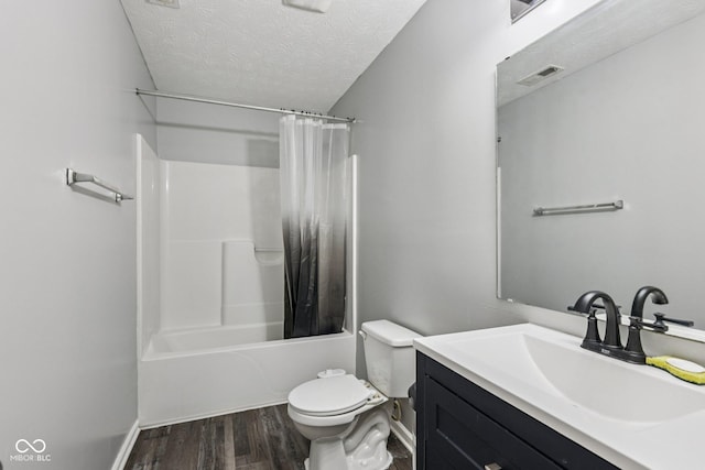 2302 Ashton Ln, Greenwood, IN 46143 - bathroom with a textured ceiling, wood finished floors, vanity, and shower / bath combination with curtain