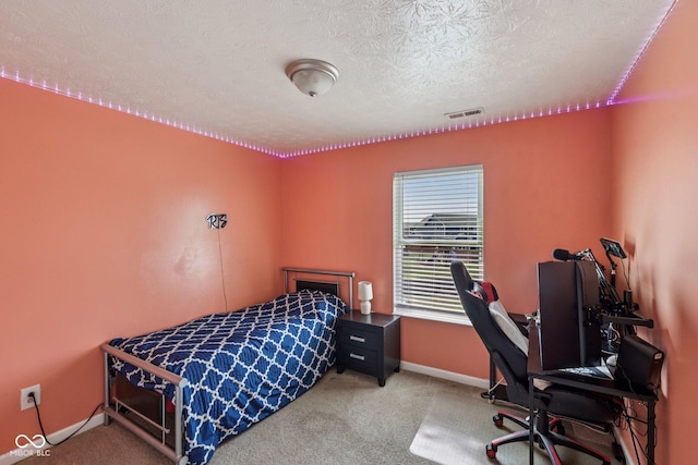 2302 Ashton Ln, Greenwood, IN 46143 - carpeted bedroom featuring a desk and a textured ceiling