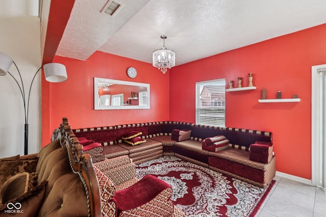 2302 Ashton Ln, Greenwood, IN 46143 - living area with tile patterned floors, a chandelier, and a textured ceiling