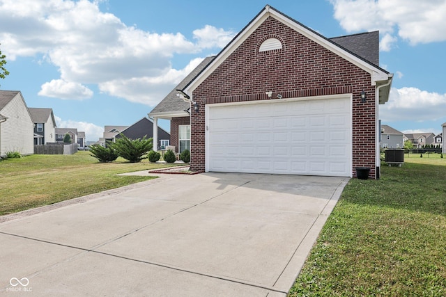 2302 Ashton Ln, Greenwood, IN 46143 - view of front of home featuring brick siding, concrete driveway, a front yard, and an attached garage