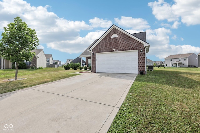 2302 Ashton Ln, Greenwood, IN 46143 - view of property exterior with brick siding, a residential view, a yard, and driveway