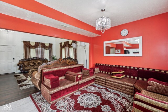 2302 Ashton Ln, Greenwood, IN 46143 - tiled living room featuring a chandelier