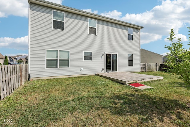 2302 Ashton Ln, Greenwood, IN 46143 - rear view of house with a fenced backyard and a wooden deck