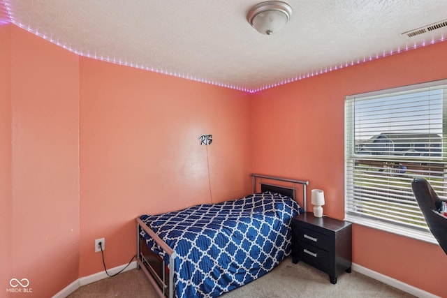 2302 Ashton Ln, Greenwood, IN 46143 - bedroom with light carpet and a textured ceiling