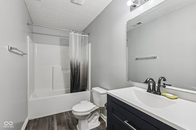 2302 Ashton Ln, Greenwood, IN 46143 - bathroom with wood finished floors, a textured ceiling, vanity, and shower / bathtub combination with curtain