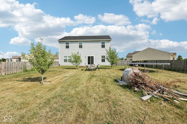 2302 Ashton Ln, Greenwood, IN 46143 - back of property featuring a fenced backyard and a trampoline