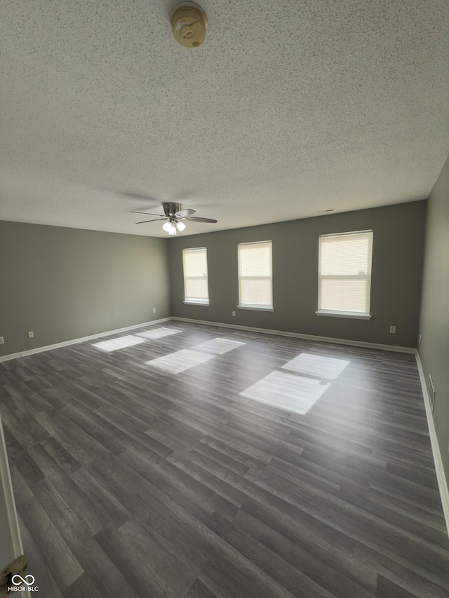 1881 Harvest Meadow Dr, Greenwood, IN 46143 - unfurnished room featuring a textured ceiling, a ceiling fan, dark wood-type flooring, and a smoke detector