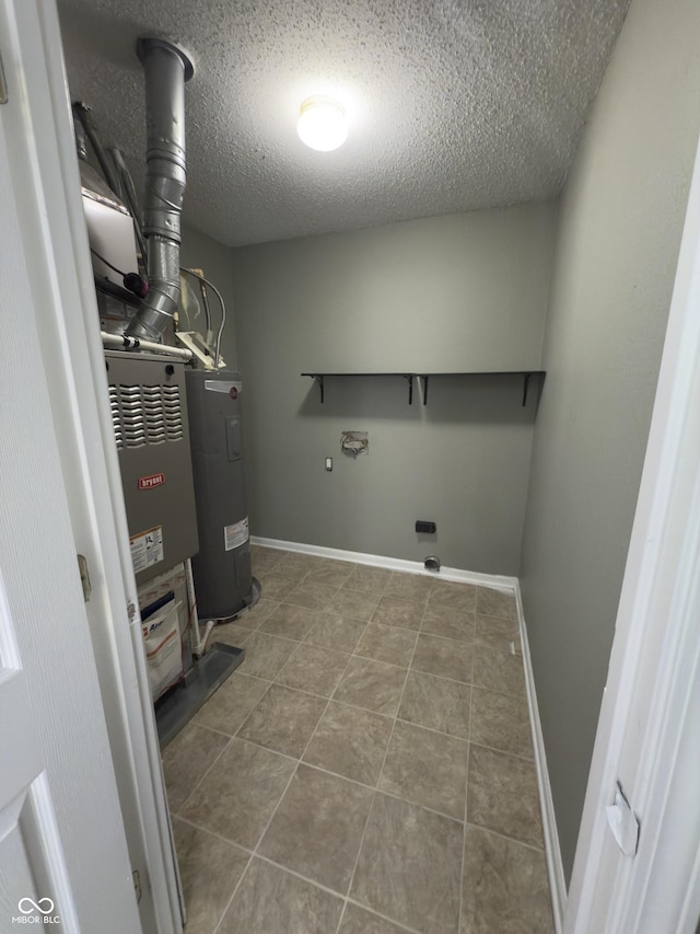 1881 Harvest Meadow Dr, Greenwood, IN 46143 - laundry area with electric water heater, hookup for an electric dryer, a textured ceiling, and tile patterned floors