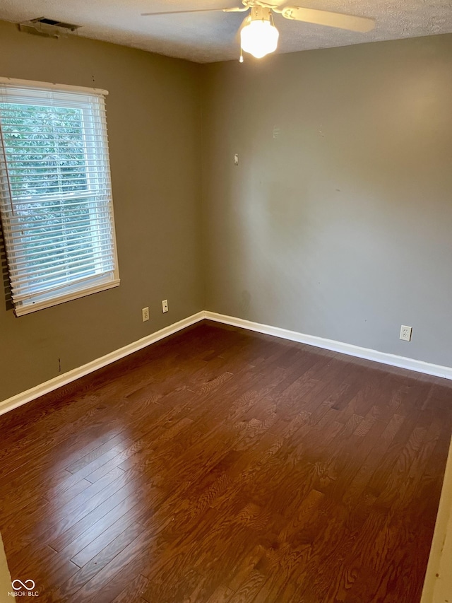 7410 Crickwood Pl, Indianapolis, IN 46268 - unfurnished room featuring dark wood-style floors and ceiling fan