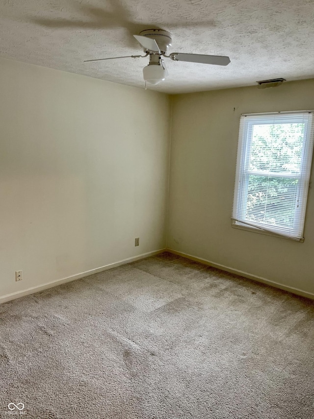 7410 Crickwood Pl, Indianapolis, IN 46268 - unfurnished room featuring carpet, a textured ceiling, and ceiling fan