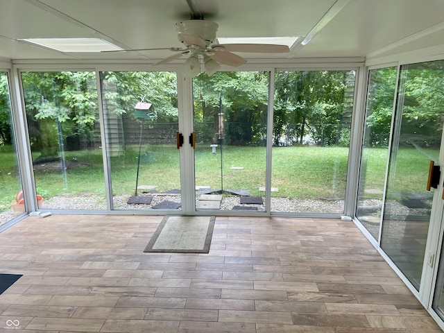 7410 Crickwood Pl, Indianapolis, IN 46268 - unfurnished sunroom with a ceiling fan and healthy amount of natural light