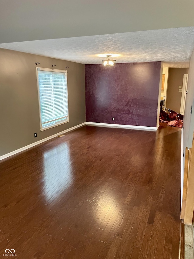 7410 Crickwood Pl, Indianapolis, IN 46268 - unfurnished room featuring hardwood / wood-style flooring and a textured ceiling
