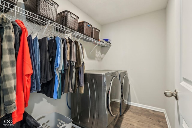 338 Limerick Ln, Pendleton, IN 46064 - laundry room with washing machine and dryer and wood finished floors