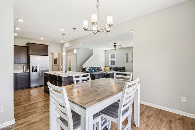 338 Limerick Ln, Pendleton, IN 46064 - dining space with light wood-type flooring, a chandelier, a ceiling fan, and recessed lighting