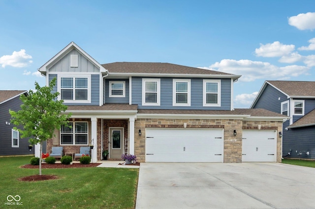 338 Limerick Ln, Pendleton, IN 46064 - craftsman-style home with board and batten siding, concrete driveway, a front yard, a garage, and a shingled roof