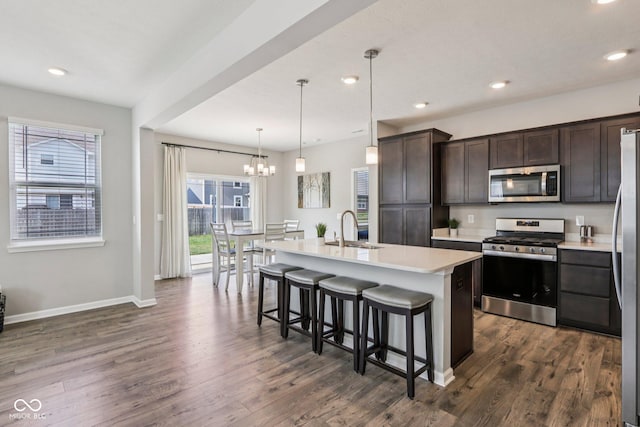 338 Limerick Ln, Pendleton, IN 46064 - kitchen with stainless steel appliances, healthy amount of natural light, dark brown cabinetry, light countertops, and recessed lighting