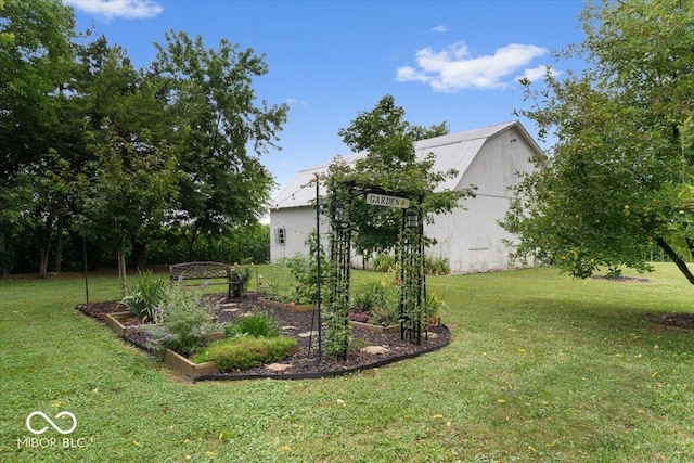 3160 S 50 E, Lebanon, IN 46052 - view of grassy yard with a vegetable garden and an outdoor structure